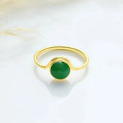 14k Gold filled ring with a green emerald gemstone on a white background