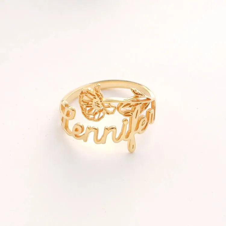 14k Gold filled birth flower name ring with 'Jennifer' cut-out on a white background
