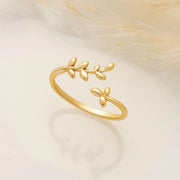 14k Gold filled ring with olive leaf design on a soft beige background