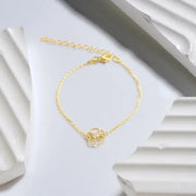 14k Gold filled birth flower cut-out bracelet on a white background