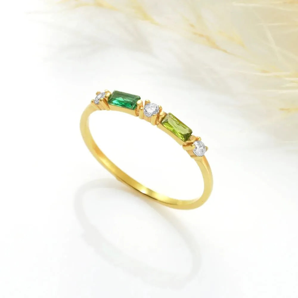 14k Gold-filled ring with Emerald and Peridot gemstones on a white background