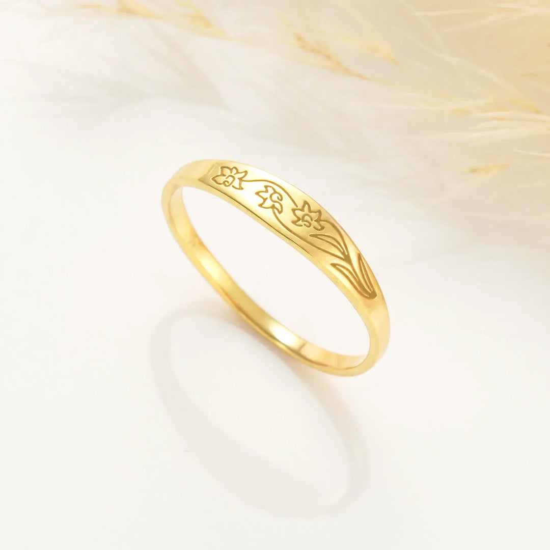 Engraved birth flower ring by Lyphiyes
