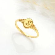 14k Gold filled ring with an engraved 'S' initial on a white background