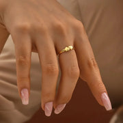 Model is wearing 14k-gold-filled tiny hearts ring