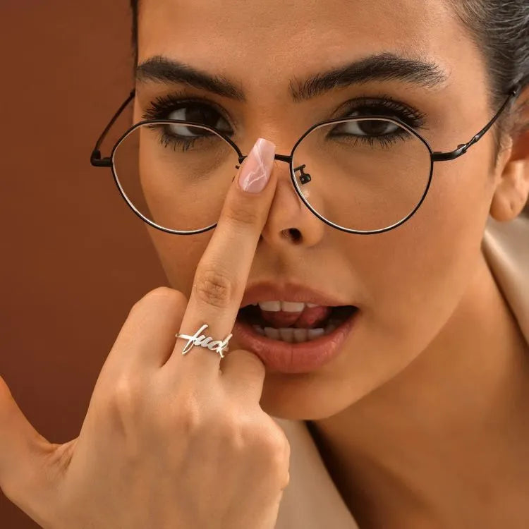 Woman model is wearing a minimalist 14k gold filled ring.