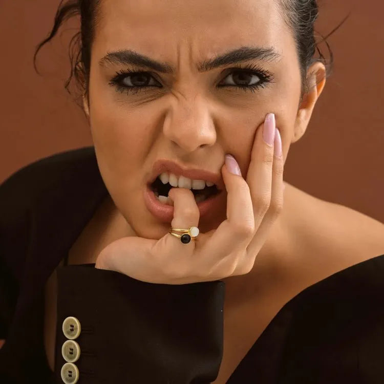 Woman model is wearing dual round natural stones rings.