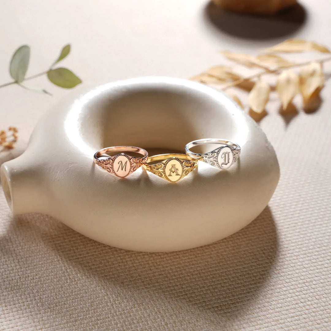 Oval signet rings in 14k gold filled, 14k rose gold filled, and 925 sterling silver with initial letter engravings
