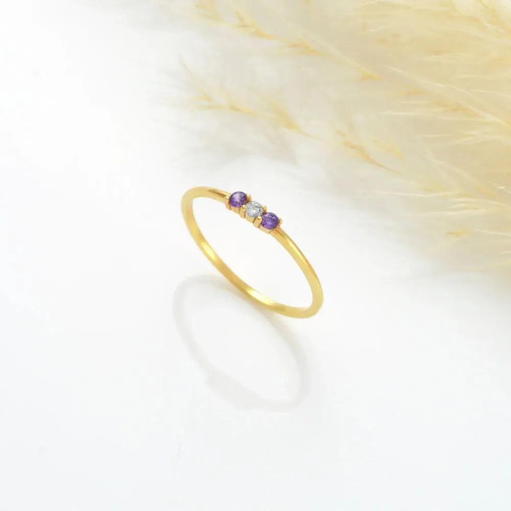 14k Gold-filled ring with purple gemstone on a white background