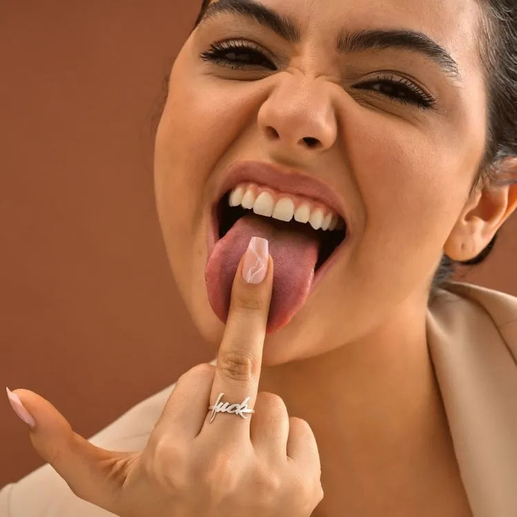 Woman model is wearing a minimalist 14k gold filled ring.