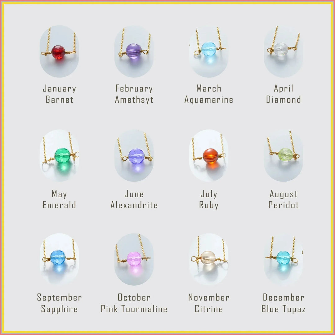 Jewelry display with gemstone necklaces corresponding to each month, on a light gray background.
Birthstones:
January - Garnet
February - Amethsyt
March - Aquamarine
April - Diamond
May - Emerald
June - Alexandrite
July - Ruby
August - Peridot
September - Sapphire
October - Pink Tourmaline
November - Citrine
December - Blue Topaz