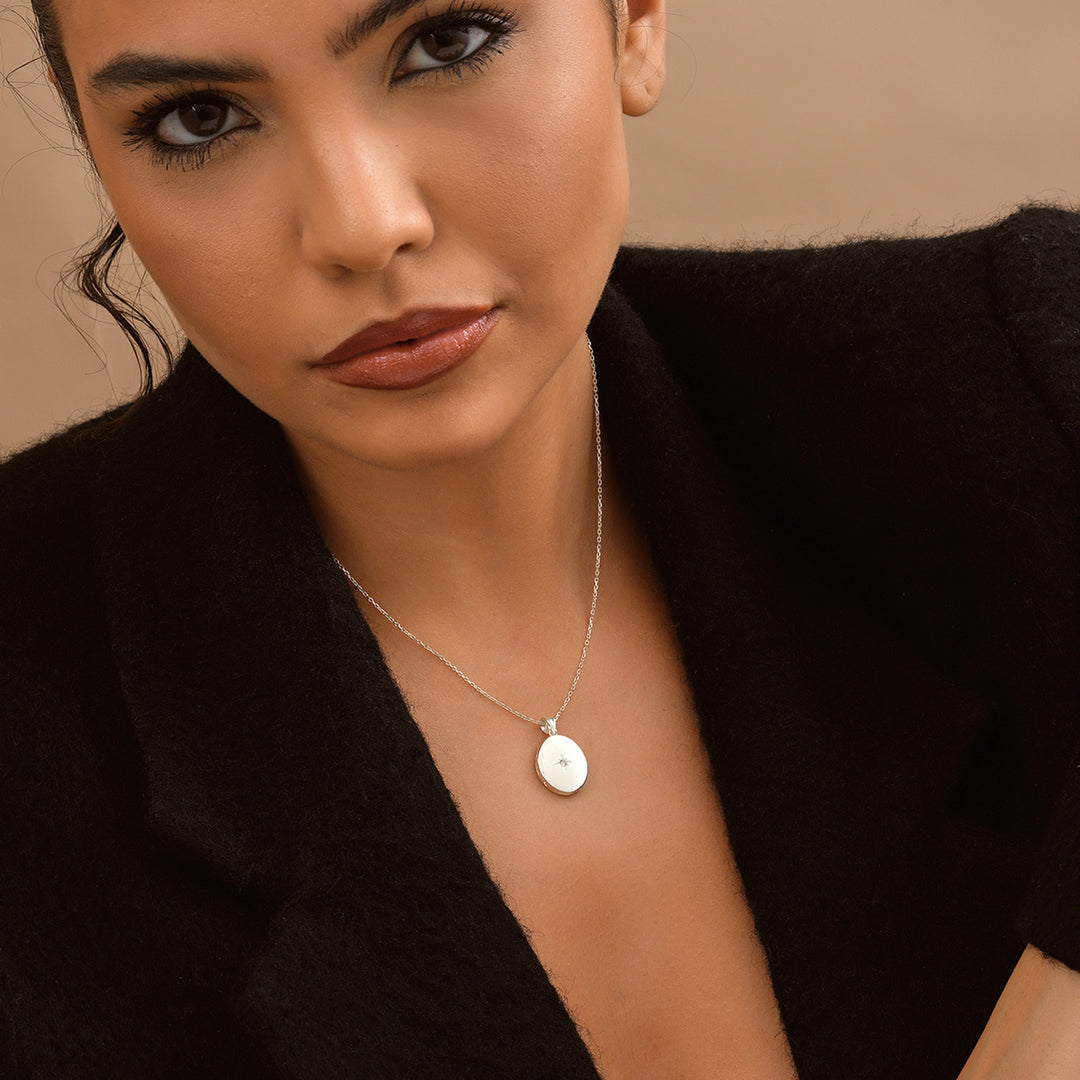 Lyphiyes Starlight Diamond Oval Locket Necklace in Silver – Elegant Model Wearing Minimalist Jewelry