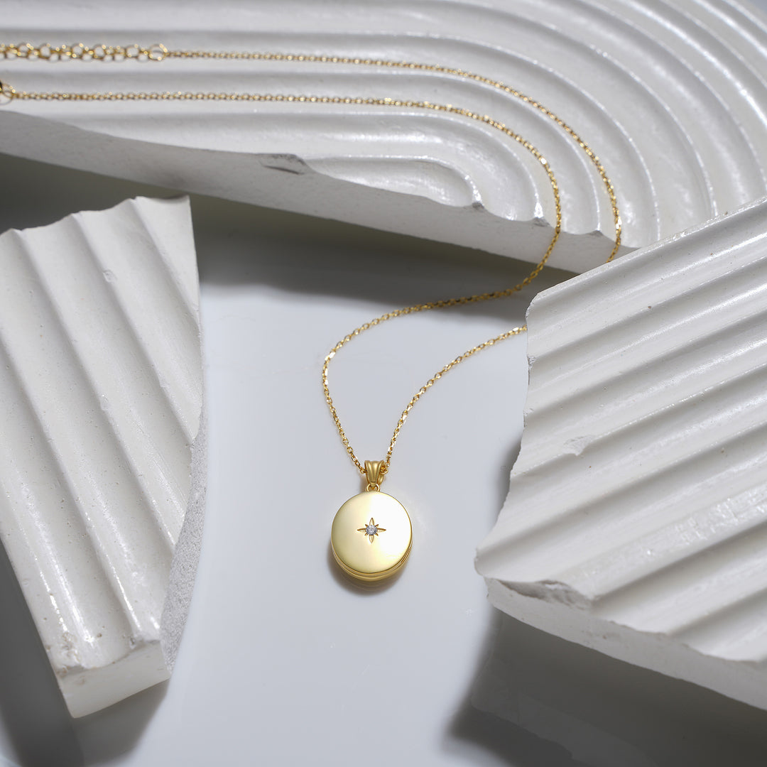 Starlight Diamond Oval Locket Necklace in 14k Gold Filled – Minimal Jewelry Display on White Geometric Surface
