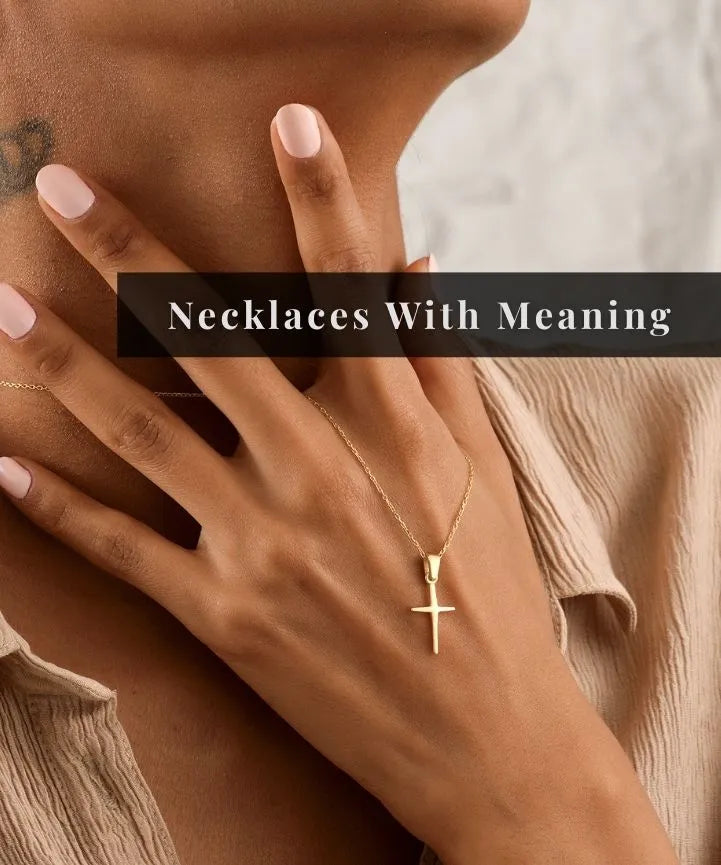 14k Gold filled necklace with a cross pendant on a hand, with text 'Necklaces With Meaning'.