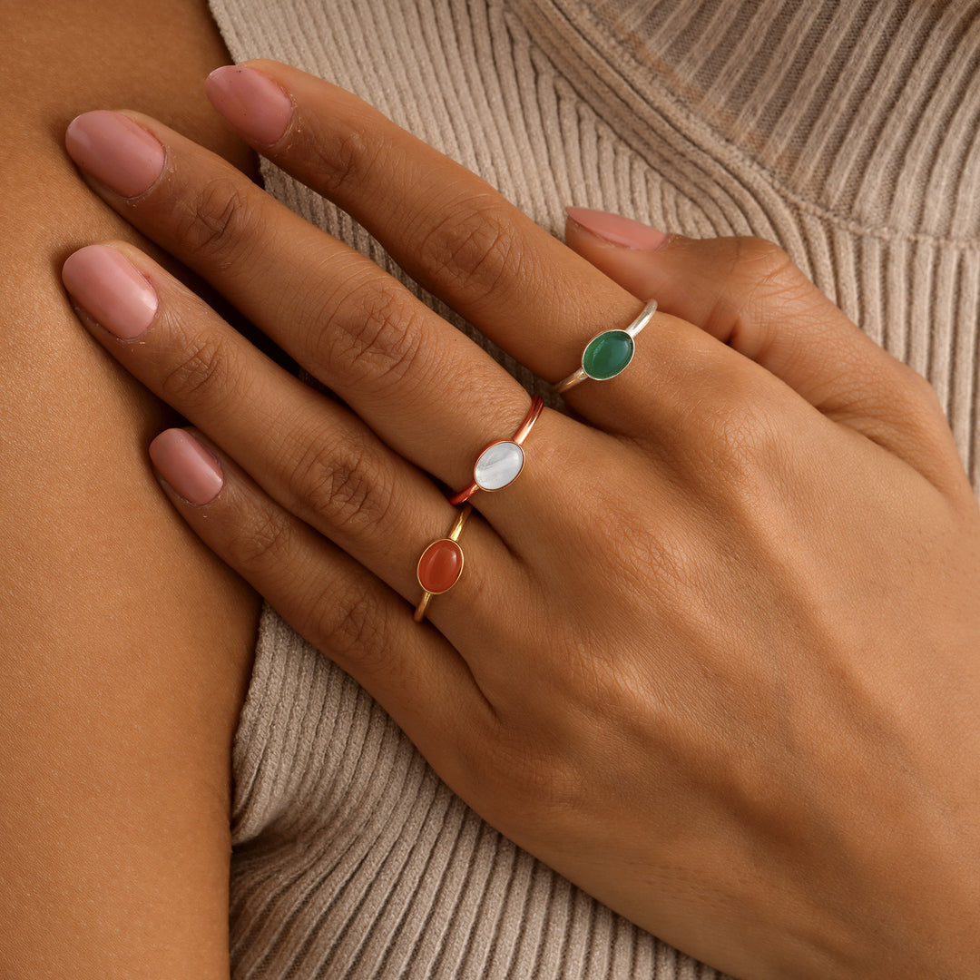 Natural Oval Moon Stone Ring II on Model’s Hand – Elegant White Gemstone Ring by Lyphiyes