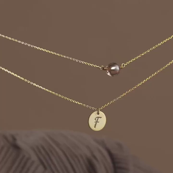 Product video of layered disc initial necklace with birthstone