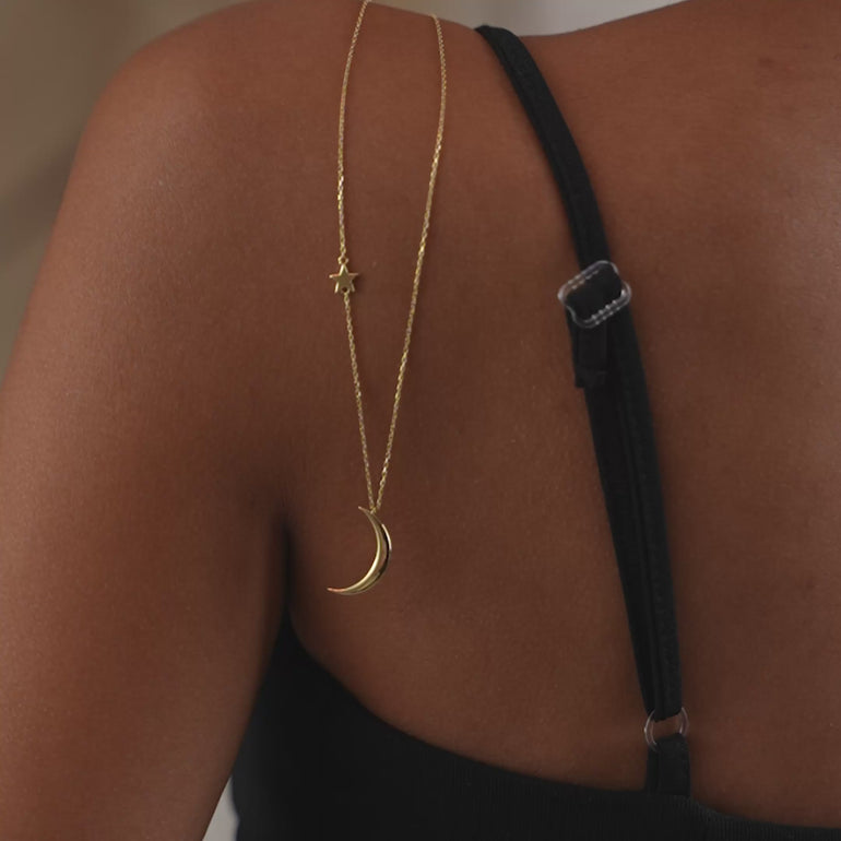 Product video of the dainty moon and star necklace