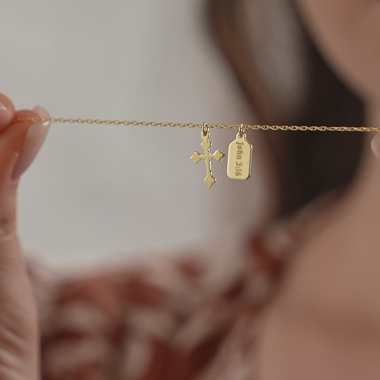 Product video of the Mini Tag Baroque Cross Necklace