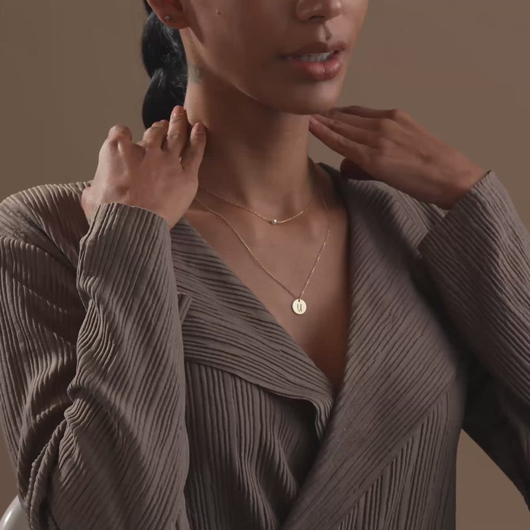 Model Wearing Lyphiyes Pearl Disc Layer Necklace – Personalized Gold Initial Necklace with Pearl Accent