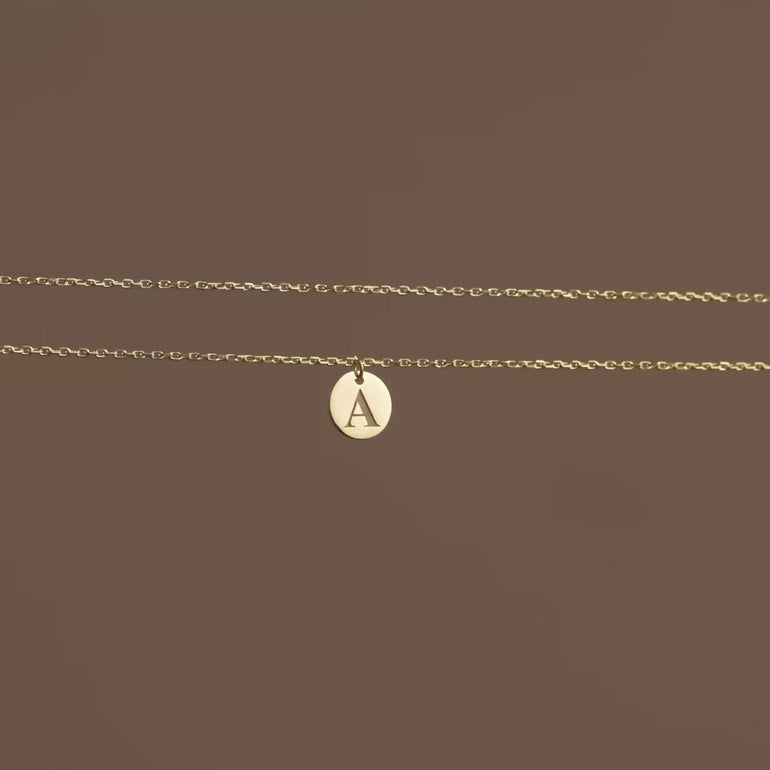 Product video of tiny discs layer necklace