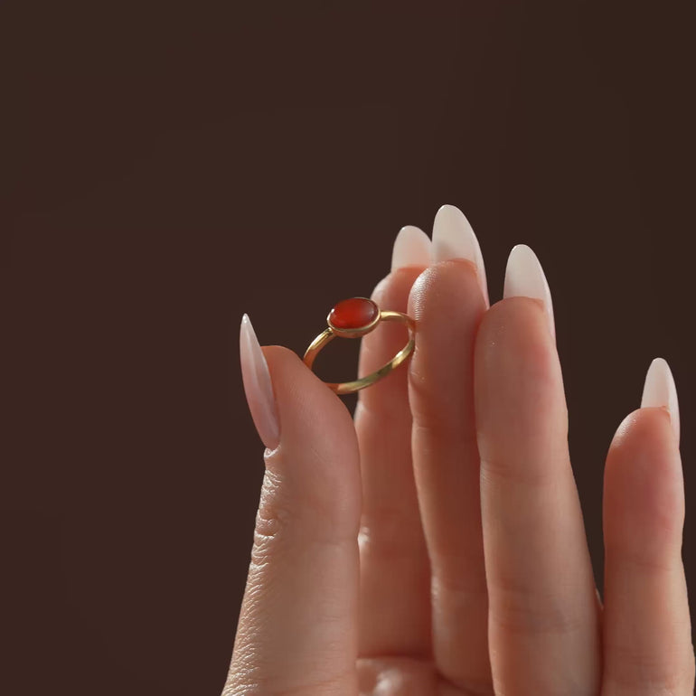Produt and lifestyle video of Natural Oval Carnelian stone