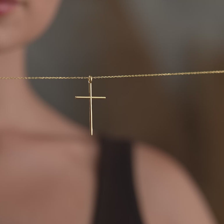 Product video of dainty cross necklace