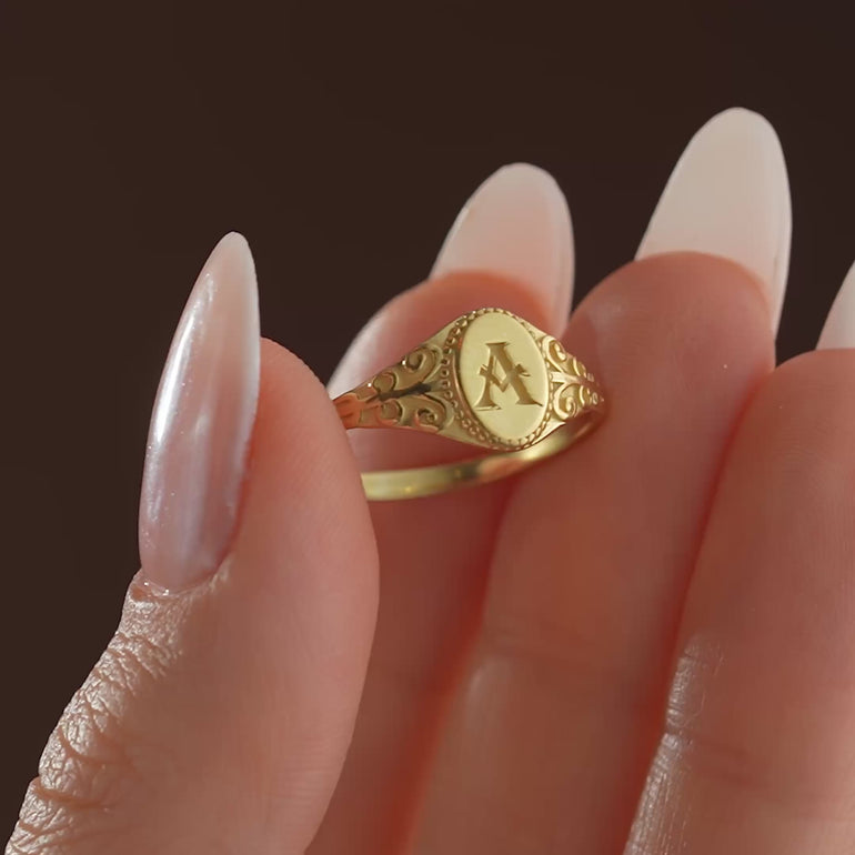 Product video showing a 14k gold filled oval signet ring with initial A engraving

